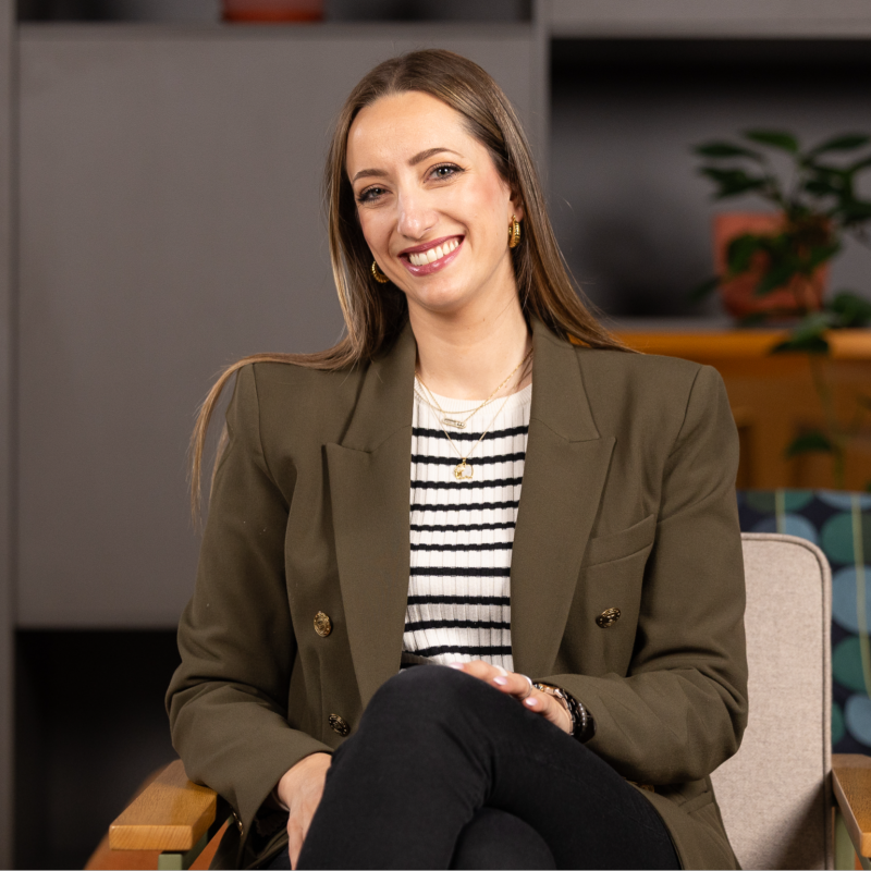 Dunja Stanivukovic seated, smiling